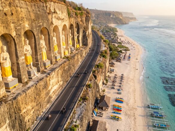 Pandawa beach with the carved statues in the cliff wall, Bali